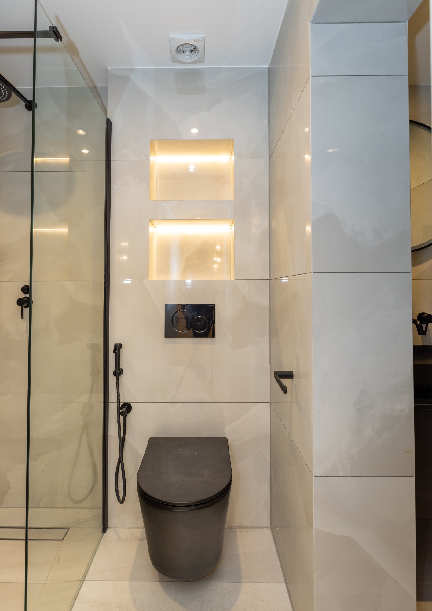 Contemporary bathroom with illuminated niches