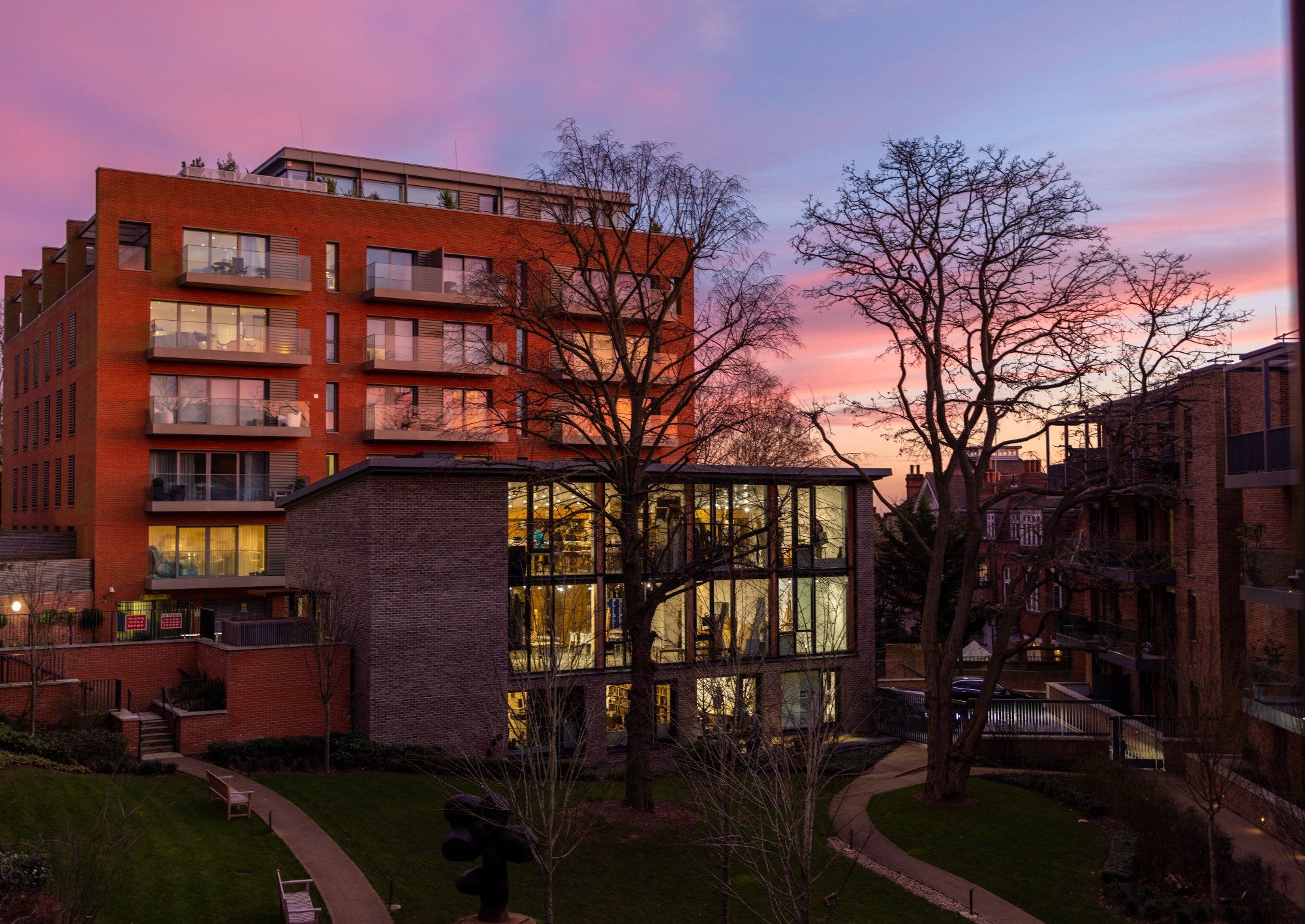 Modern development at dusk with pink sky