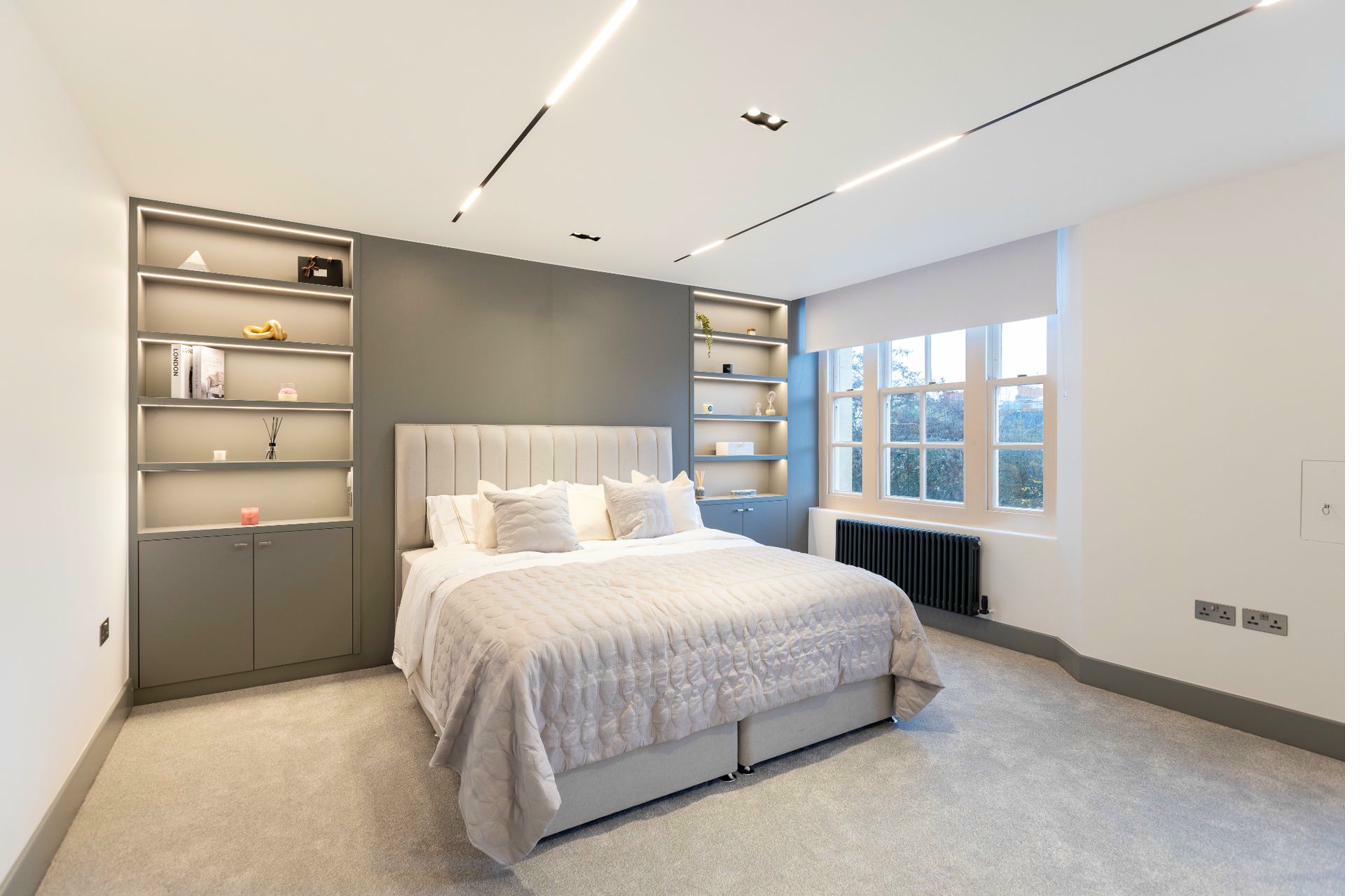 Luxury bedroom with designer headboard and ambient lighting