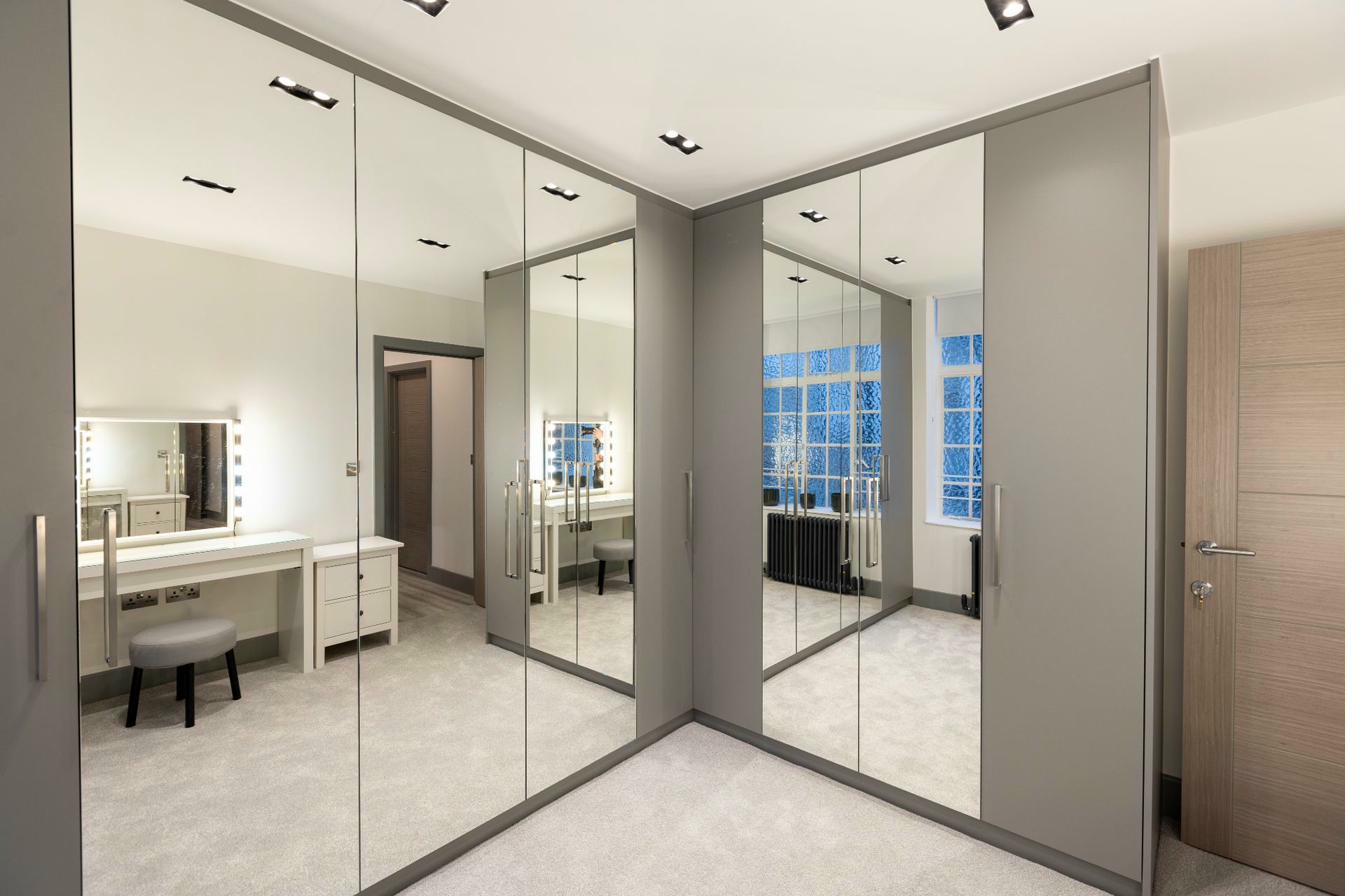 Elegant dressing room with mirrored storage