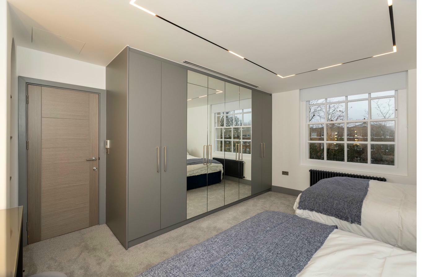 Contemporary bedroom with statement pendant light