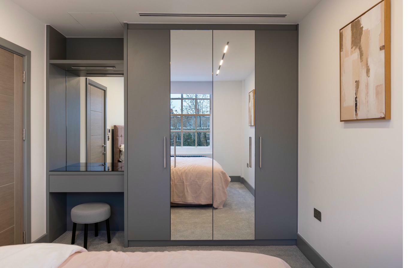 Bespoke wardrobe with organised shelving and lighting