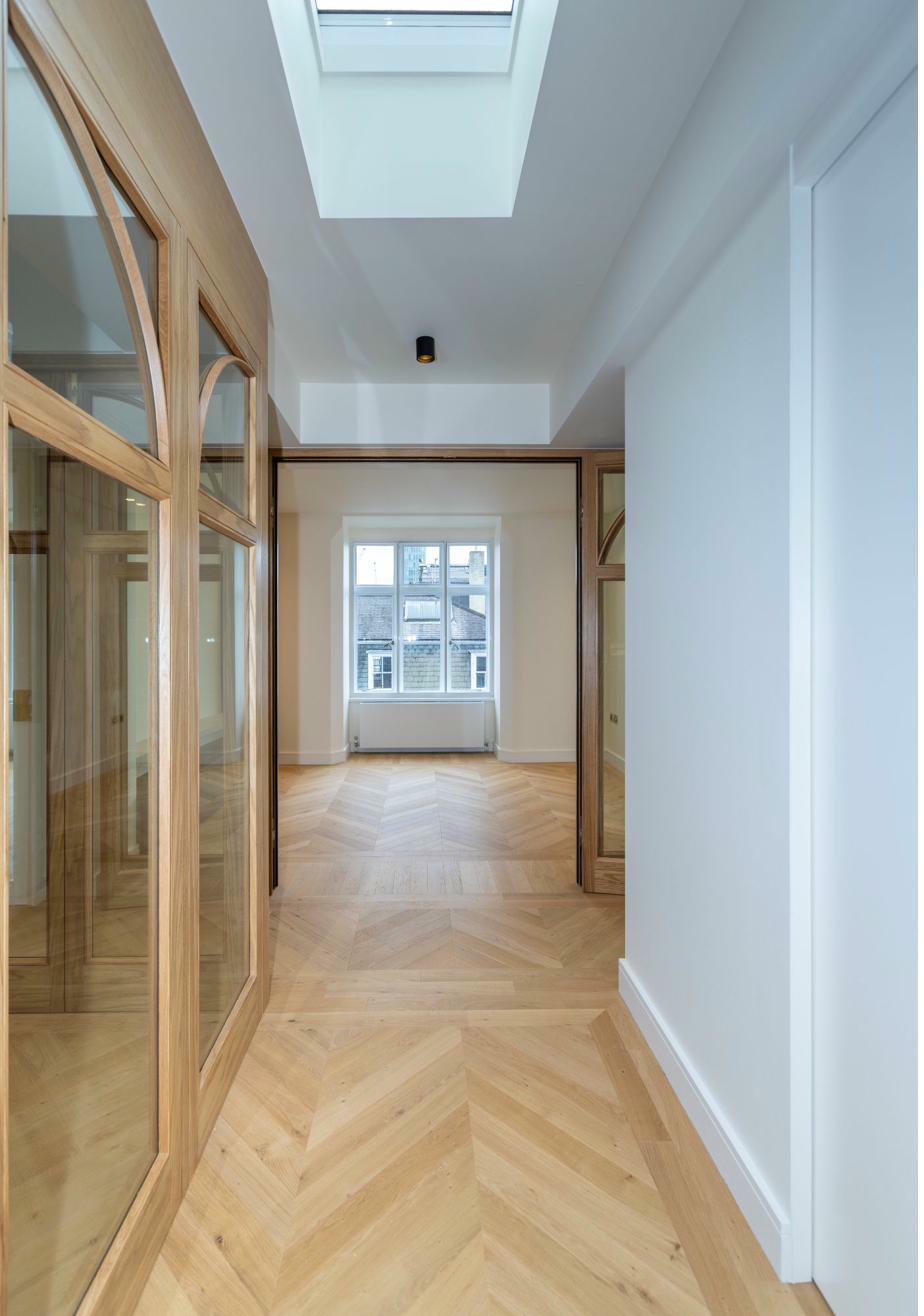 Grand living room with marble flooring and statement art
